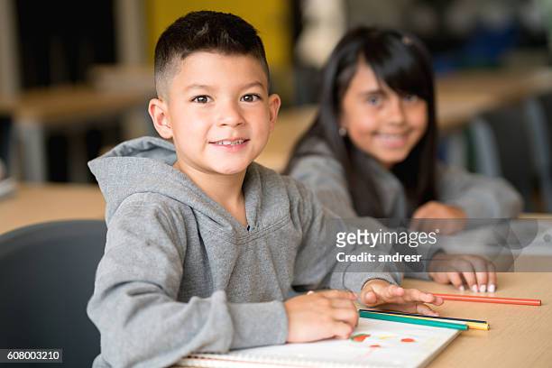 happy boy at the school - colombian ethnicity stockfoto's en -beelden