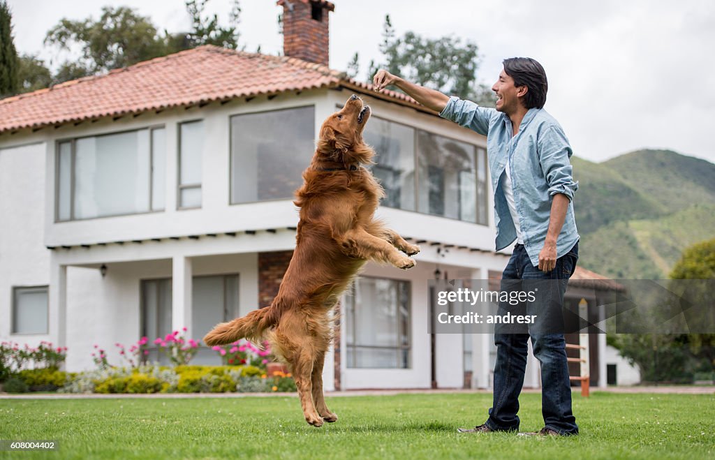 Happy man training his dog