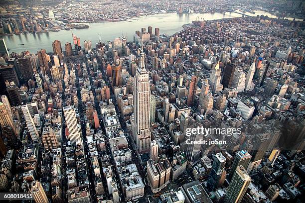 aerial of empire state building  and manhattan - aerial new york fotografías e imágenes de stock