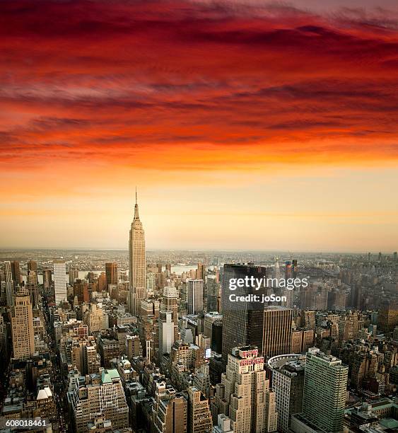 aerial view of empire state building and city - empire state building red stock pictures, royalty-free photos & images