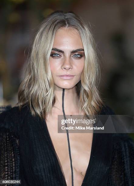 Cara Delevingne attends the Burberry show during London Fashion Week Spring/Summer collections 2016/2017 on September 19, 2016 in London, United...