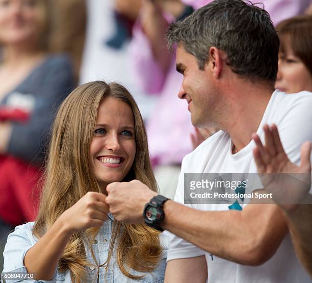 Kim Sears, Andy Murray's girlfriend, celebrates his win with physiotherapist Andy Ireland after Murray's men's singles quarter-final victory over...