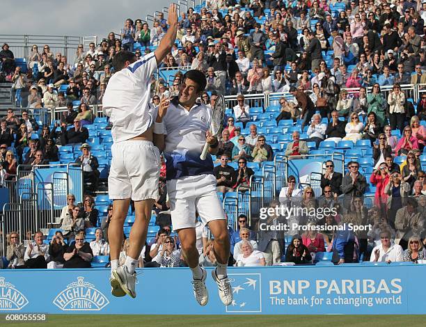 Novak Djokovic of Serbia and Jonathan Erlich of Israel celebrate winning their doubles final match against Karol Beck of Slovakia and David Skoch of...