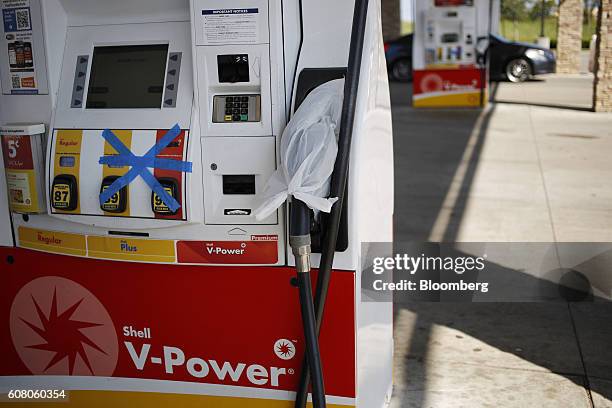 Out of service fuel pumps stand at a Royal Dutch Shell Plc gas station in Spring Hill, Tennessee, U.S., on Monday, Sept. 19, 2016. Customers buying...