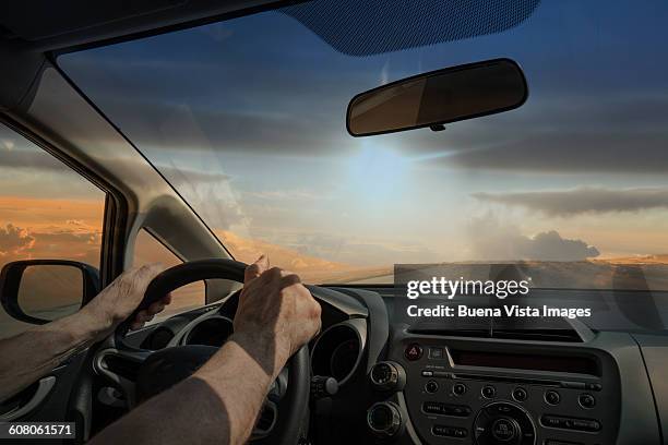 man driving a car in the desert - arab driving stock-fotos und bilder