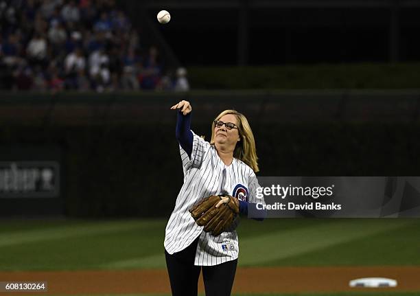 Actress Bonnie Hunt throws out a ceremonial first pitch before the game between the Chicago Cubs and the Cincinnati Reds on September 19, 2016 at...