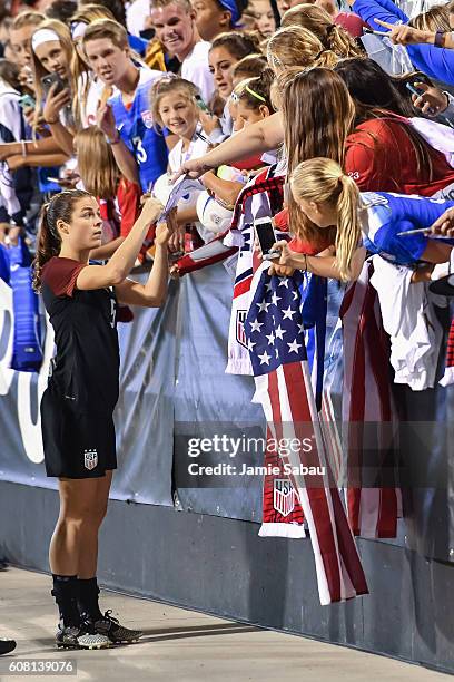 Kelley O'Hara of the US Women's National Team signs autographs for fans after a game against Thailand on September 15, 2016 at MAPFRE Stadium in...