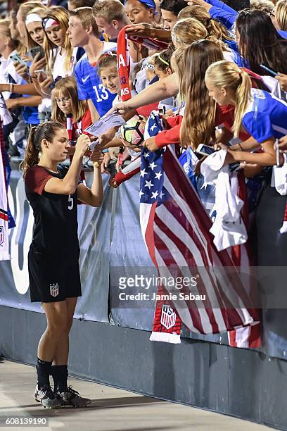 Kelley O'Hara of the US Women's National Team signs autographs for fans after a game against Thailand on September 15, 2016 at MAPFRE Stadium in...