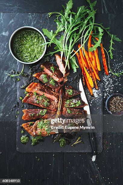 t-bone steak with herbs and vegetables - chimichurri stock pictures, royalty-free photos & images