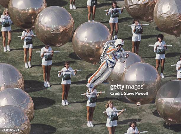 Bill Suitor by means of the Bell Aerosystems rocket pack hovers over the stadium during the opening ceremony for the XXIII Olympic Games on 28 July...