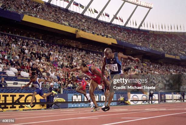 1st place Allen Johnson of the United States and 2nd place Anier Garcia of Cuba running at the finish line during the Men's 110M Hurddles Final Event...