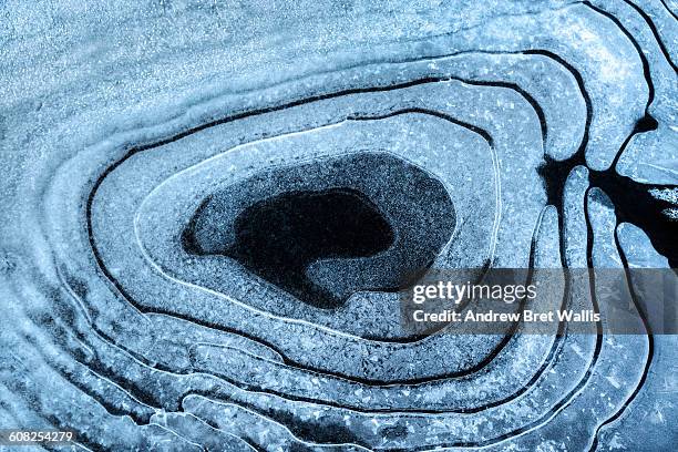 naturally formed circular patterns in pond ice. - ice pattern stock pictures, royalty-free photos & images