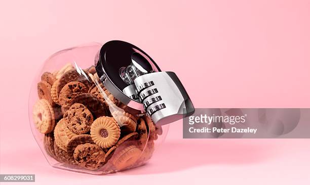 biscuit jar with padlock - cookie jar stock pictures, royalty-free photos & images