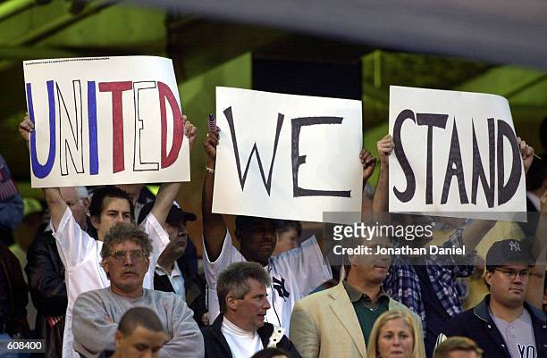 Fans hold up a "United We Stand" sign before the New York Yankees take on the Chicago White Sox at Comiskey Park in Chicago, Illinois. DIGITAL IMAGE....