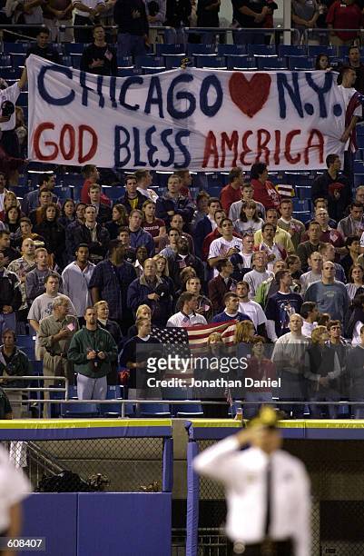 Fans hold up a "Chicago Loves New York/God Bless America" sign before the N.Y. Yankees take on the Chicago White Sox at Comiskey Park in Chicago, IL....