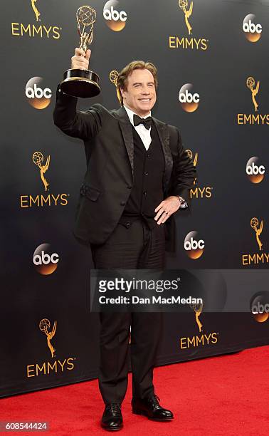 Actor/producer John Travolta, winner of the Outstanding Limited Series award for 'The People vs. OJ Simpson: American Crime Story, poses in the press...