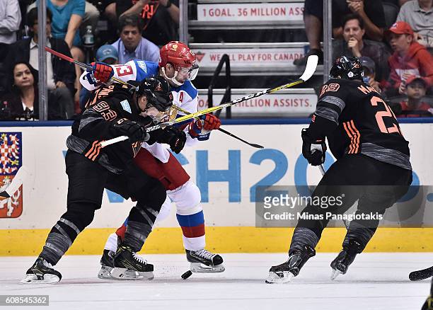 Ryan Nugent-Hopkins of Team North America battles for a loose puck with Pavel Datsyuk of Team Russia during the World Cup of Hockey 2016 at Air...