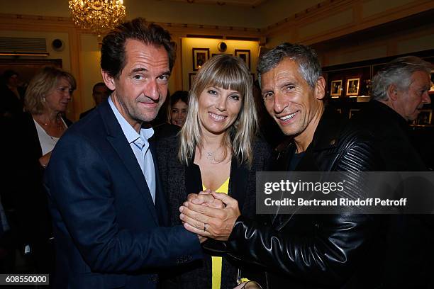 Actor of the play, Stephane De Groodt, TV Presenter Nagui with his wife actress Melanie Page attend the "Tout ce que vous voulez" : Theater Play at...