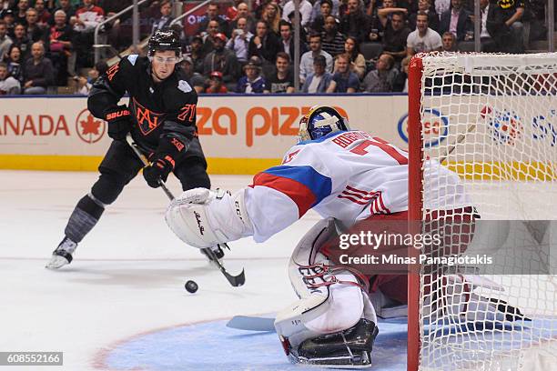 Dylan Larkin of Team North America skates the puck towards Sergei Bobrovsky of Team Russia during the World Cup of Hockey 2016 at Air Canada Centre...