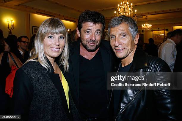 Singer Patrick Bruel standing between TV Presenter Nagui with his wife actress Melanie Page attend the "Tout ce que vous voulez" : Theater Play at...