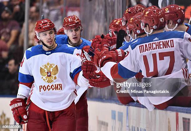 Alexei Emelin of Team Russia high fives the bench after a second period goal against Team North America during the World Cup of Hockey 2016 at Air...