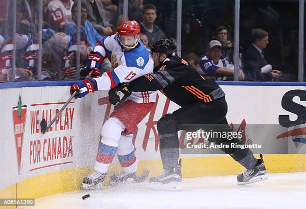 Colton Parayko of Team North America hits Pavel Datsyuk of Team Russia into the boards during the World Cup of Hockey 2016 at Air Canada Centre on...