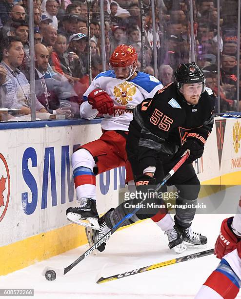 Mark Scheifele of Team North America collides with Dmitry Kulikov of Team Russia along the boards during the World Cup of Hockey 2016 at Air Canada...