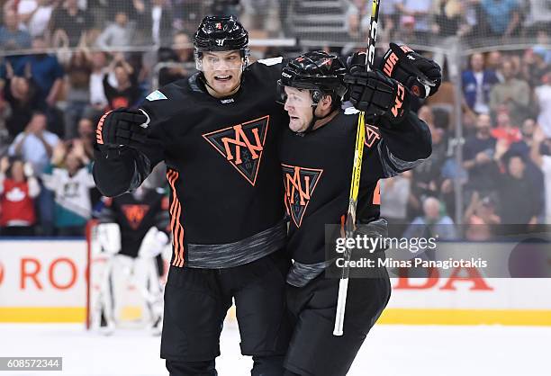 Morgan Rielly celebrates with Colton Parayko of Team North America after scoring a second period goal on Team Russia during the World Cup of Hockey...