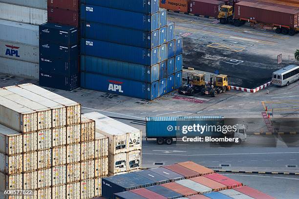 Truck transporting a Hanjin Shipping Co. Container drives past other containers at Tanjong Pagar Container Terminal, operated by PSA International...