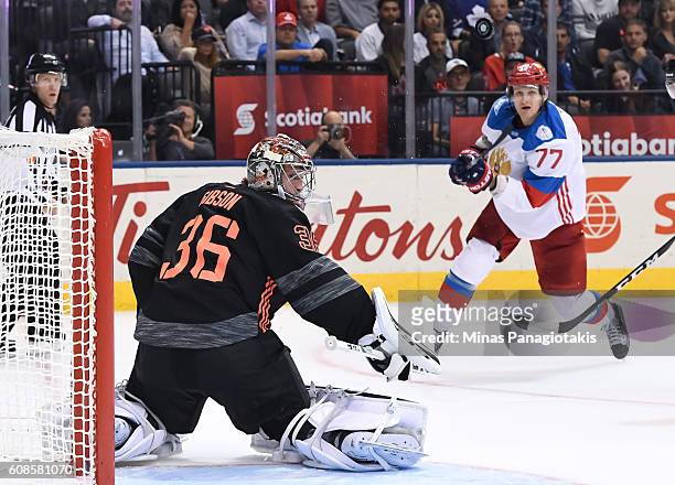 John Gibson of Team North America and Ivan Telegin of Team Russia track a flying puck during the World Cup of Hockey 2016 at Air Canada Centre on...