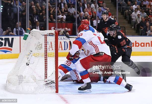 Ryan Nugent-Hopkins of Team North America gets the puck past Sergei Bobrovsky of Team Russia to score a third period goal during the World Cup of...