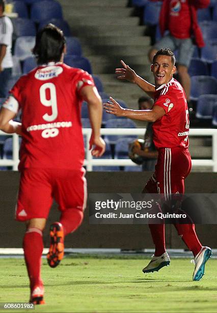 Camilo Ayala of America de Cali celebrates with teammate Ernesto Farias after scoring the opening goal during a match between America de Cali and...