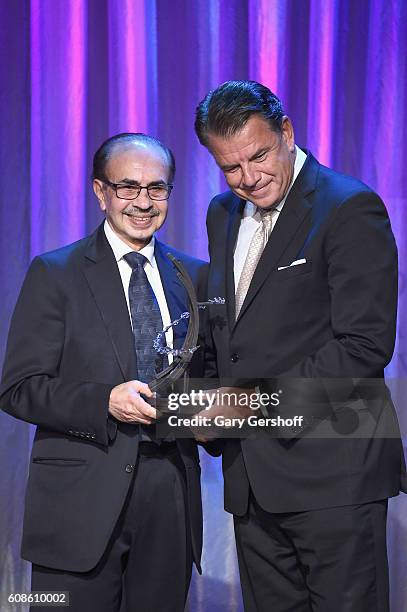 Event honoree Adi Godrej and President & CEO, Western Union, Hikmet Ersek seen on stage at the 10th Annual Clinton Global Citizen Awards at Sheraton...