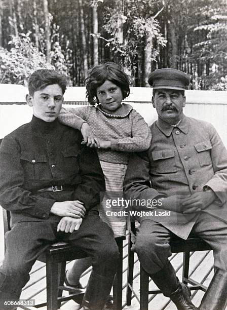 Soviet leader Joseph Stalin with his son, Vasily and daughter Svetlana at one of Stalin's dachas, former Soviet Union, June 1935. Both children are...