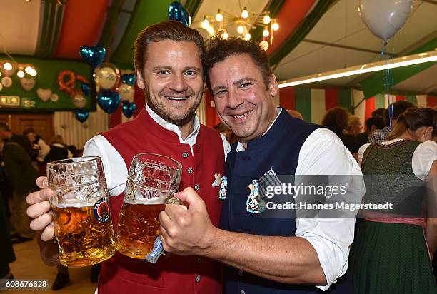 David Meister and his brother Andreas Meister during the BMW Armbrustschiessen as part of the Oktoberfest 2016 at Armbrust-Schuetzenfesthalle on...