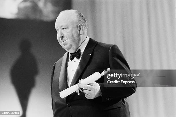 British-born film director Alfred Hitchcock wins the BAFTA Academy Fellowship Award at the Society of Film and Television Arts Awards at the Royal...