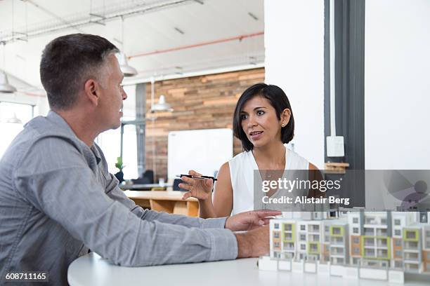 business meeting in open office - leanincollection stockfoto's en -beelden