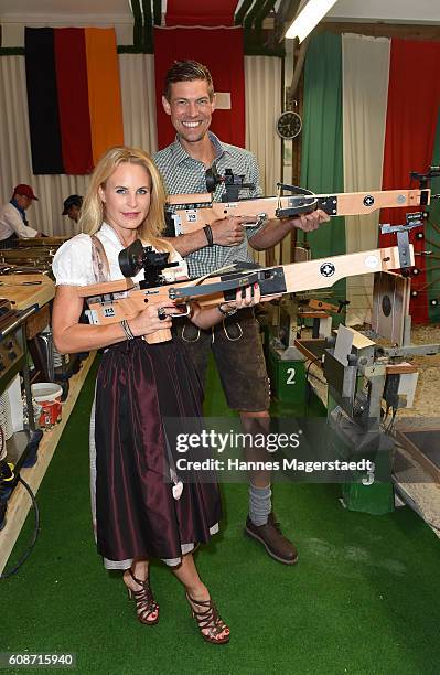 Designer Sonja Kiefer and Cedric Schwarz during the BMW Armbrustschiessen as part of the Oktoberfest 2016 at Armbrust-Schuetzenfesthalle on September...