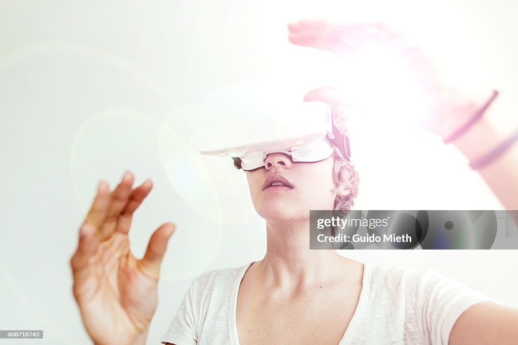 Woman using a virtual reality headset.