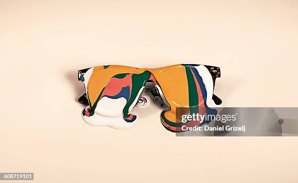 object covered in paint - colored sunglasses stockfoto's en -beelden