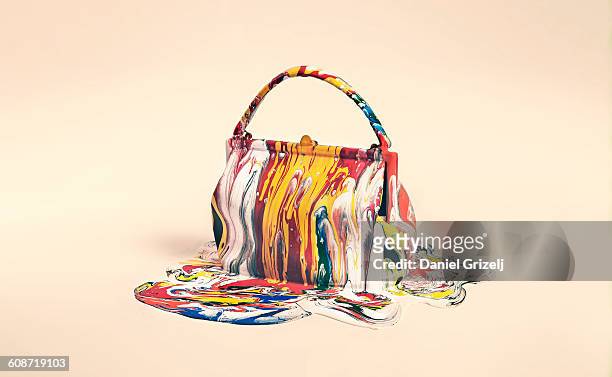 object covered in paint - multi colored purse ストックフォトと画像