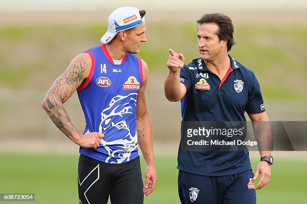 Head Coach Luke Beveridge speaks to Clay Smith during a Western Bulldogs training session at Whitten Oval on September 20, 2016 in Melbourne,...