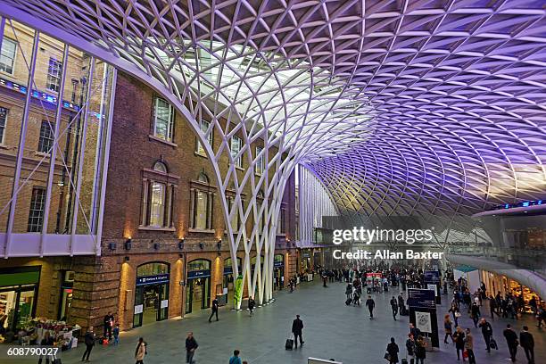 interior of the revamped kings cross station - london architecture stock pictures, royalty-free photos & images