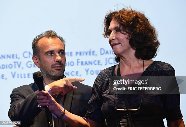 French philosopher Abdennour Bidar looks at French producer Fabienne Servan-Schreiber during the launching of a citizens movement called "General...