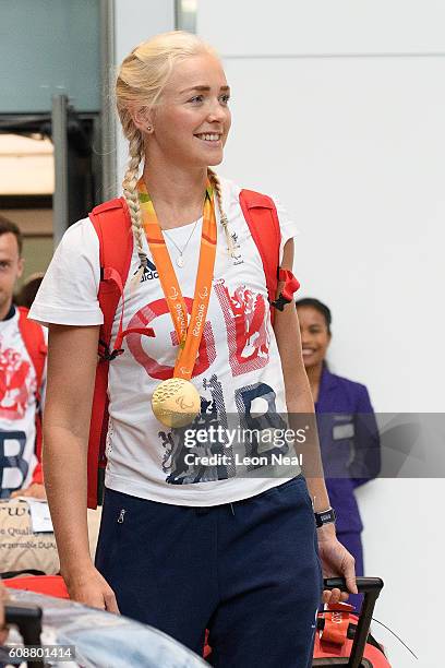 Gold medallist Pamela Relph poses is greeted after arriving on British Airways flight BA2016 from Rio de Janeiro to London Heathrow Terminal 5 on...