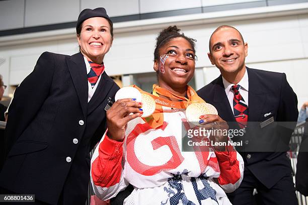 Gold medallist Kadeena Cox poses with her medals after arriving on British Airways flight BA2016 from Rio de Janeiro to London Heathrow Terminal 5 on...