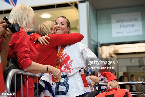 Gold medallist Cyclist Corrine Hall is greeted by supporters after arriving on British Airways flight BA2016 from Rio de Janeiro to London Heathrow...