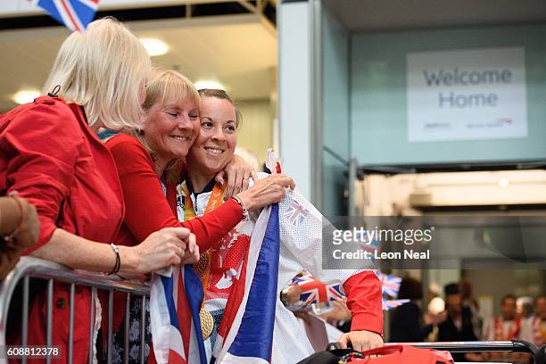 Gold medallist Cyclist Corrine Hall is greeted by supporters after arriving on British Airways flight BA2016 from Rio de Janeiro to London Heathrow...
