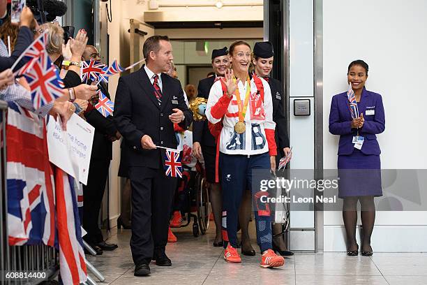 Gold medallist Anne Dickens is greeted by supporters after arriving on British Airways flight BA2016 from Rio de Janeiro to London Heathrow Terminal...