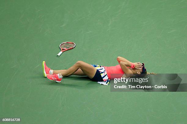 Open - Day 13 Angelique Kerber of Germany falls to the ground in celebration after winning the Women's Singles Final against Karolina Pliskova of the...